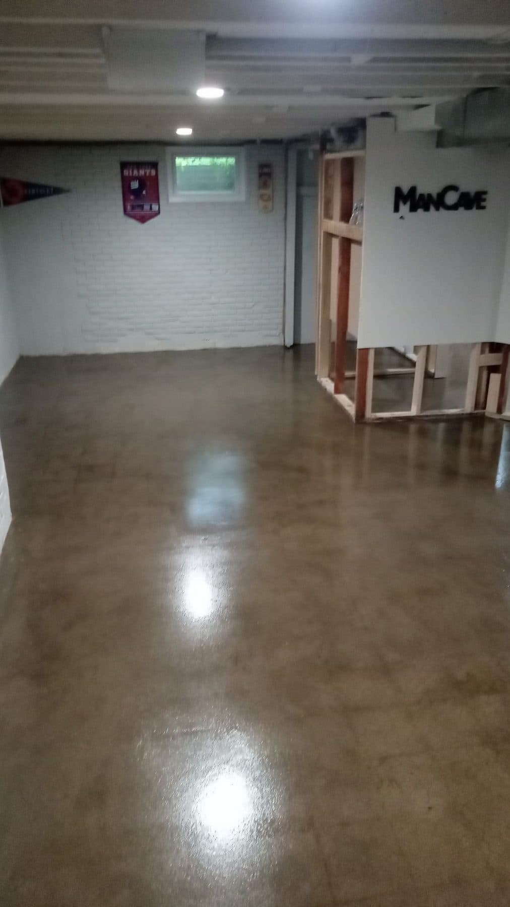 The same basement slab after grinding and sealing